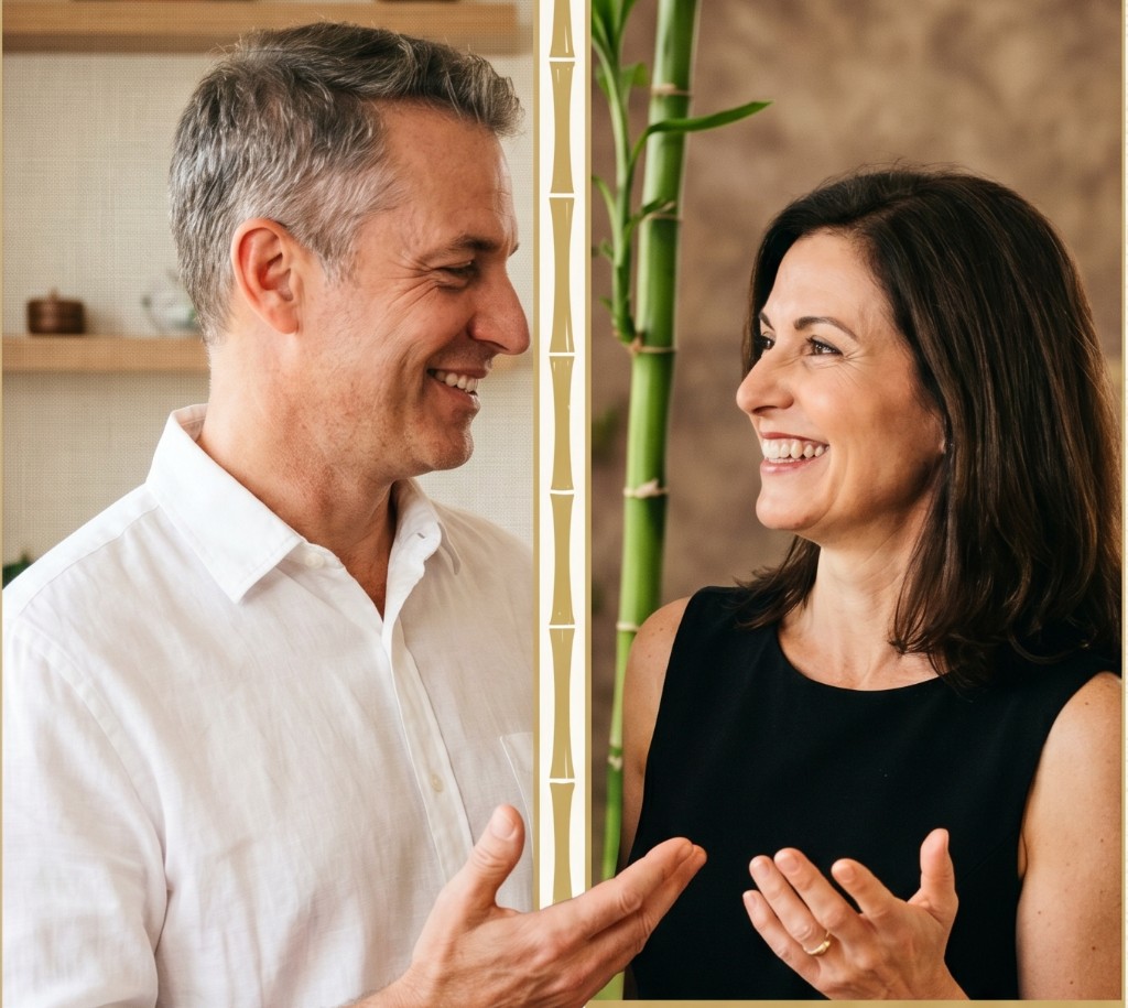Smiling couple with a stylized bamboo divider between them